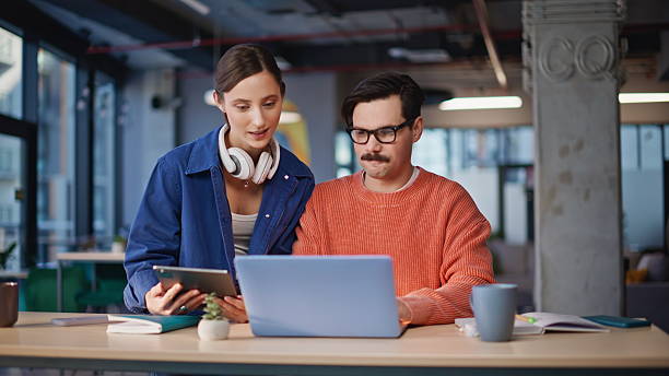 istock Company staff looking laptop screen collaborating on online project closeup. 2236913763