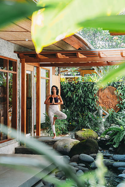 istock Woman practicing tree pose during yoga wellness retreat 2236914739