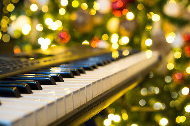 istock Selective focus of piano keys with a blurred tree in the background 2236917333
