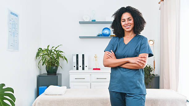 istock Confident Physiotherapist In Clinic Smiling For The Camera Ready For Physical Therapy Session 2236917741