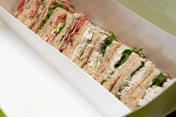Chicken sandwiches and BLT sandwiches in a box
