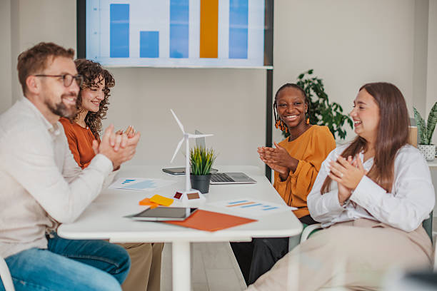 istock Team of young professionals collaborating cheerfully in a modern startup office setting 2236919304