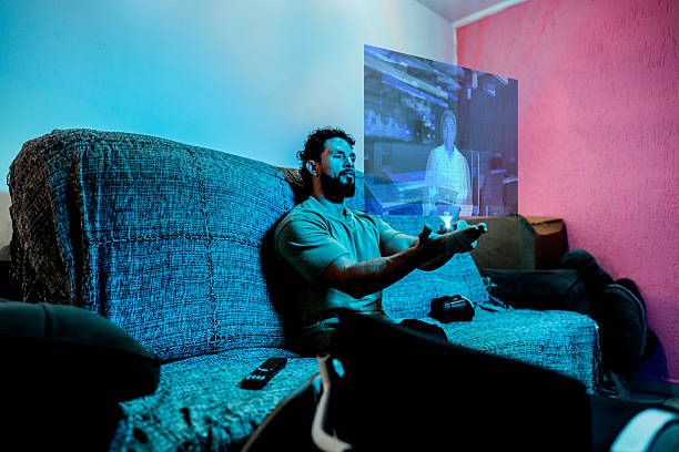 istock Mid adult man with amputee legs doing a video chat using augmented reality at home 2236920243