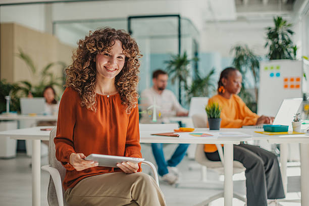 istock Young professional enjoying teamwork at a modern startup office while planning innovative ideas with colleagues 2236920980