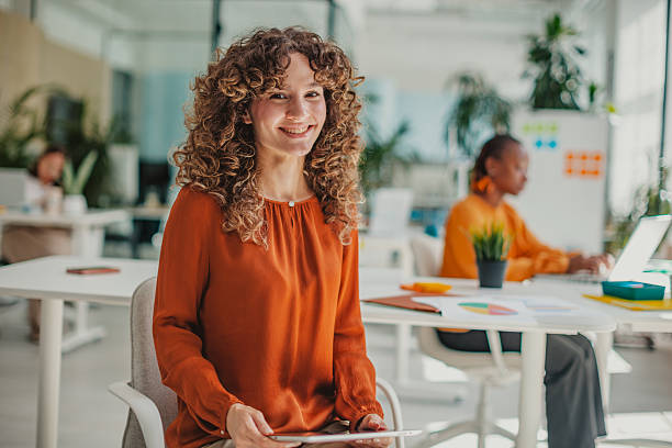 istock Young professional working in a modern startup office, collaborating and sharing ideas in a vibrant environment 2236922097