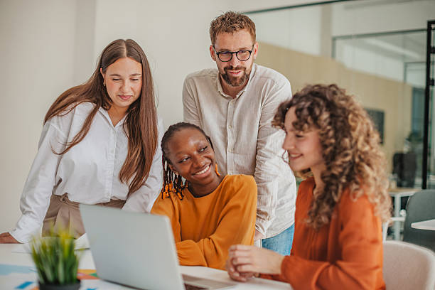 istock Young professionals brainstorm ideas in a modern startup office while working together and sharing smiles 2236922226