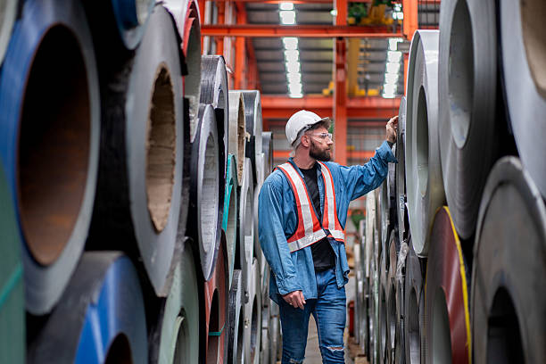 istock man engineer worker check and inspect material metal sheet roll in warehouse 2236922394