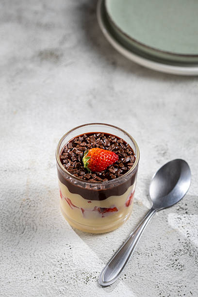 istock Dessert made with vanilla cream, strawberries and chocolate topping. 2236922868