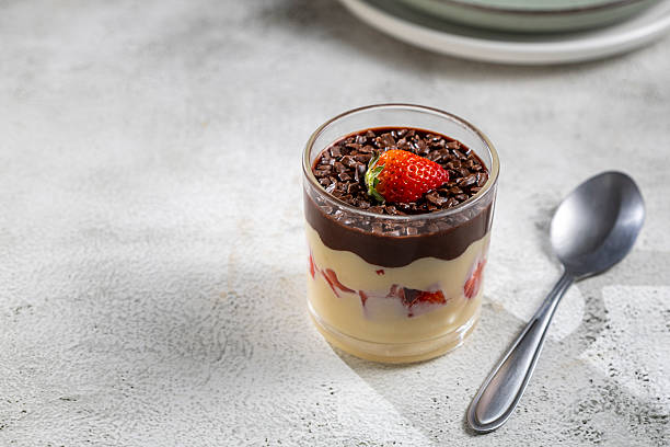 istock Dessert made with vanilla cream, strawberries and chocolate topping. 2236922870