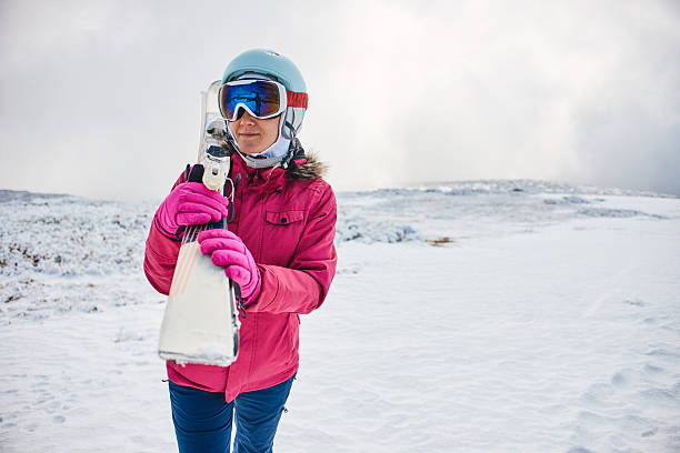 Young adult woman on skiing. Copy space.