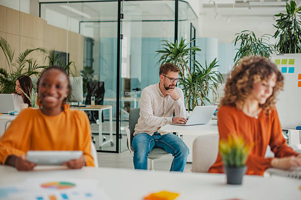 istock Young professionals collaborate in a bright startup office, fostering creativity and teamwork in a modern environment 2236923382