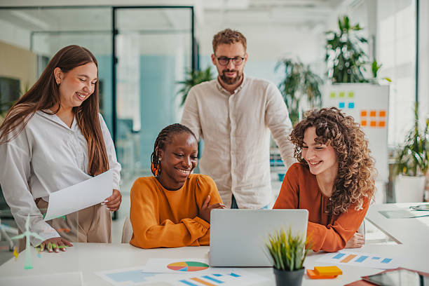 istock Young professionals collaborate in a bright startup office, sharing ideas and fostering teamwork for project success 2236923430