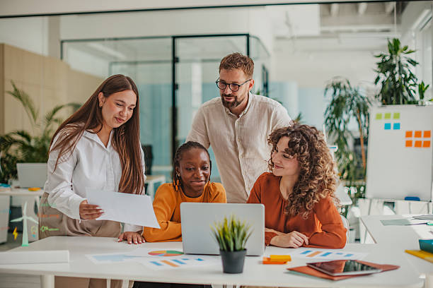 istock Young professionals collaborate in a modern startup office environment, sharing ideas and solutions together for business success 2236923773