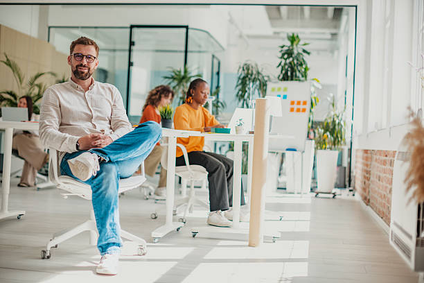 istock Young professionals collaborate in a modern startup office space filled with sunlight and ideas 2236923812