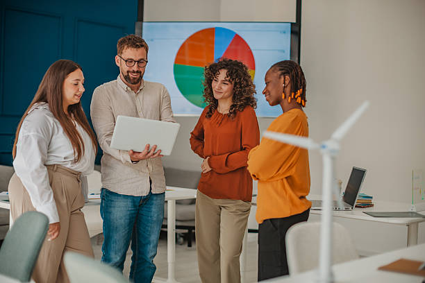 istock Young professionals collaborate in a modern startup office while discussing innovative ideas for business growth and success 2236924178