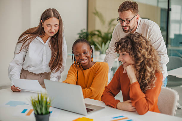 istock Young professionals collaborate in a modern startup office, sharing ideas and celebrating success 2236924349