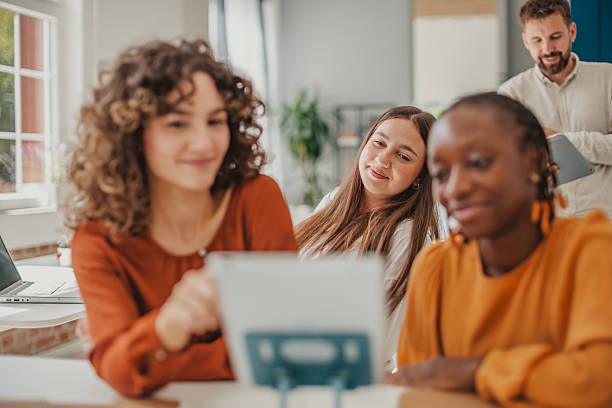 istock Young professionals collaborate in a modern startup office, sharing ideas and fostering teamwork for success and growth 2236924697