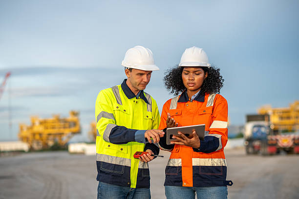 istock Industrial engineer operations marine port cranes loading and unloading of cargo ships global trade and supply chain import export environment monitoring responsible global economy. 2236924711