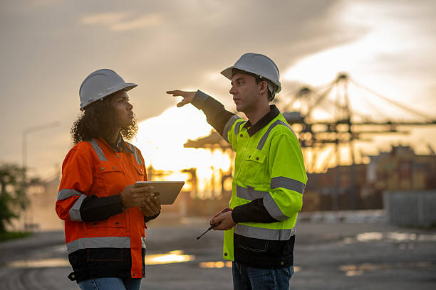 istock Industrial engineer operations marine port cranes loading and unloading of cargo ships global trade and supply chain import export environment monitoring responsible global economy. 2236924725