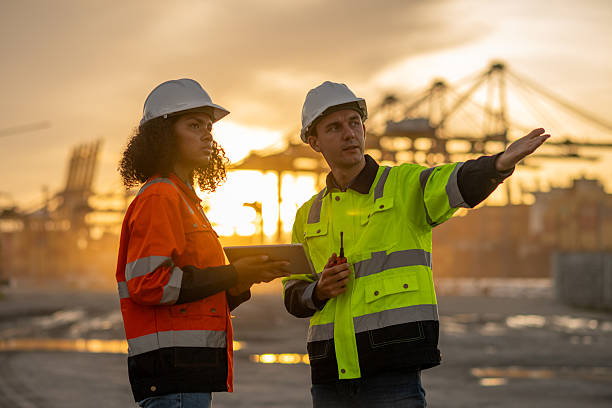 istock Industrial engineer operations marine port cranes loading and unloading of cargo ships global trade and supply chain import export environment monitoring responsible global economy. 2236924746