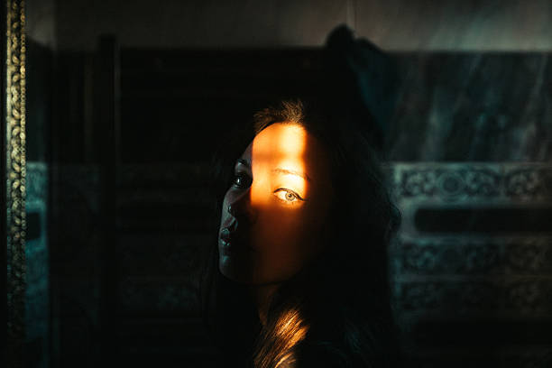 istock Moody Cinematic Portrait with Light and Shadow Play 2236925958