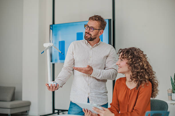 istock Young professionals collaborate on innovative ideas in a modern startup office, showcasing teamwork and enthusiasm for technology 2236926258