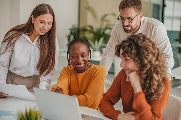 istock Young professionals collaborate on startup ideas in a vibrant office space 2236926341