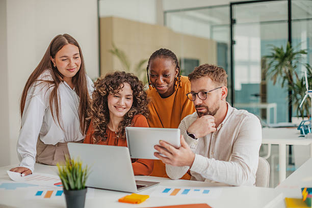 istock Young professionals collaborating and sharing ideas in a modern startup office 2236926482