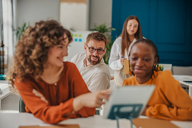 istock Young professionals collaborating and sharing ideas in a modern startup office space with a cheerful atmosphere 2236926520