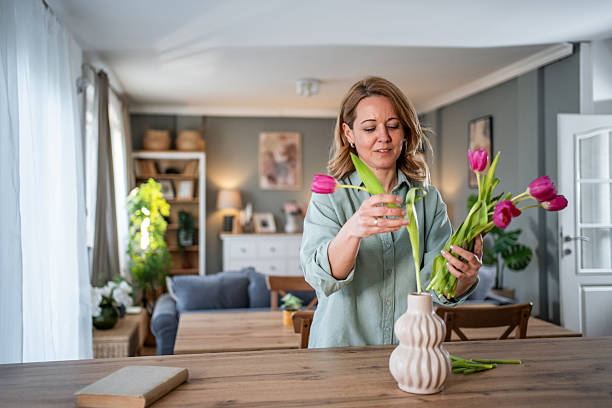 istock Woman arranging spring tulips for home decoration 2236926883