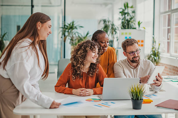 istock Young professionals collaborating in a modern startup office while sharing ideas and enjoying productive teamwork 2236928089