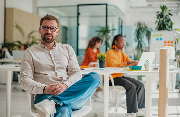 istock Young professionals collaborating in a modern startup office with a cheerful atmosphere and engaging teamwork 2236928129