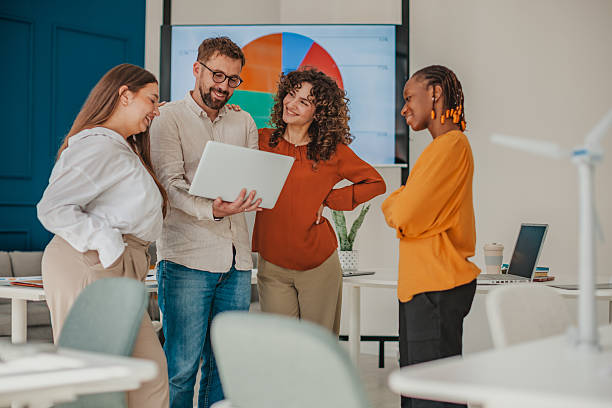 istock Young professionals collaborating in a modern startup office, sharing ideas and strategies for business growth 2236928347