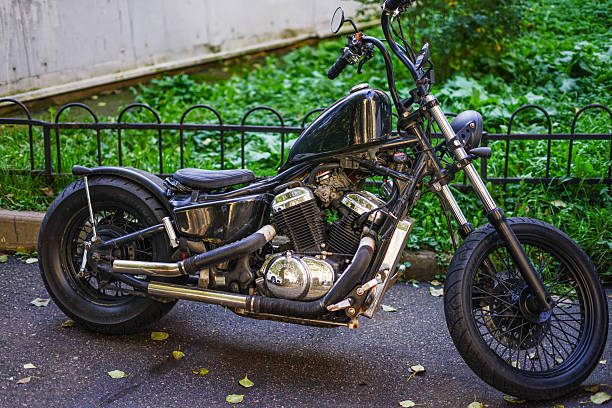 Russia, Saint Petersburg - September 21, 2025: Black Custom Motorcycle Bobber on the street