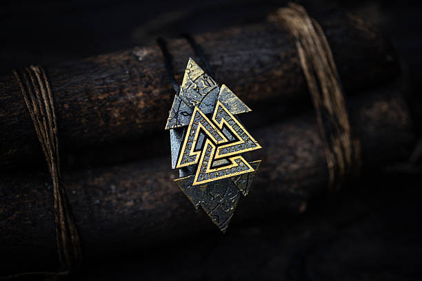 istock Valknut - Ancient Nordic Symbol Rune Design on dark aged background 2236929932