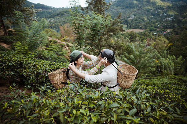 Tourist Assisting Friend With Traditional Headscarf During Cultural Experience