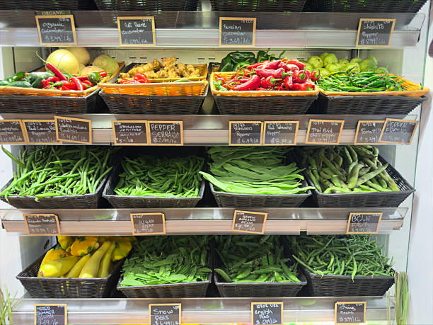 Wooden crates with different vegetables in the market place.