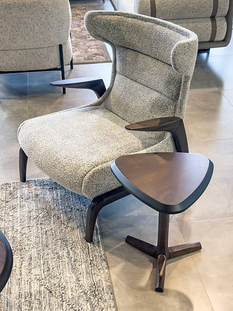 Upholstered armchair and sidetable