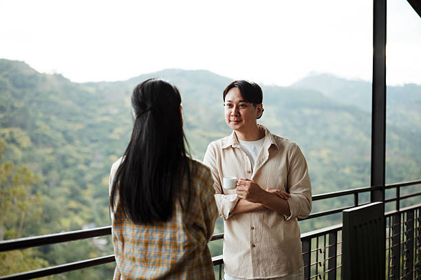 istock Travelers Savoring Hot Beverage While Admiring Scenic View 2236931256