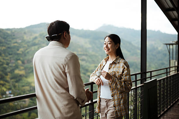 istock Travelers Savoring Hot Beverage While Admiring Scenic View 2236931267