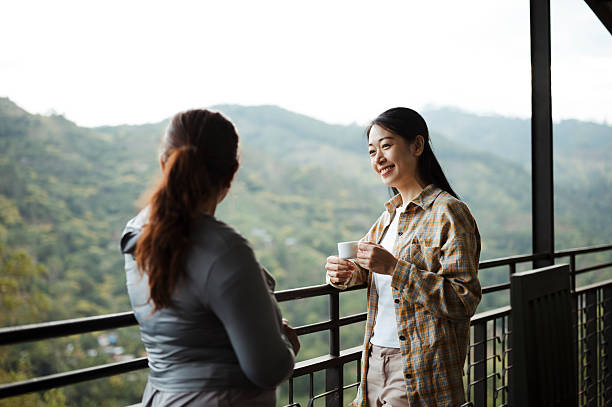 istock Travelers Savoring Hot Beverage While Admiring Scenic View 2236931278