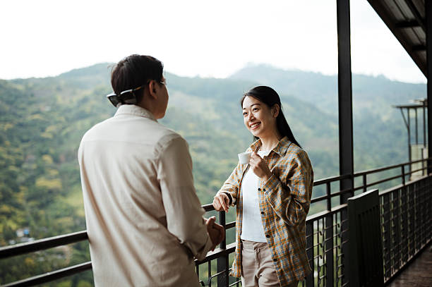 istock Travelers Savoring Hot Beverage While Admiring Scenic View 2236931287