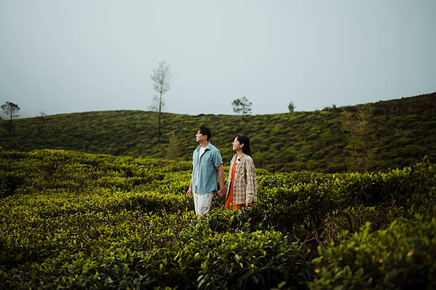 istock Couple Walking Through Scenic Tea Plantation 2236931922