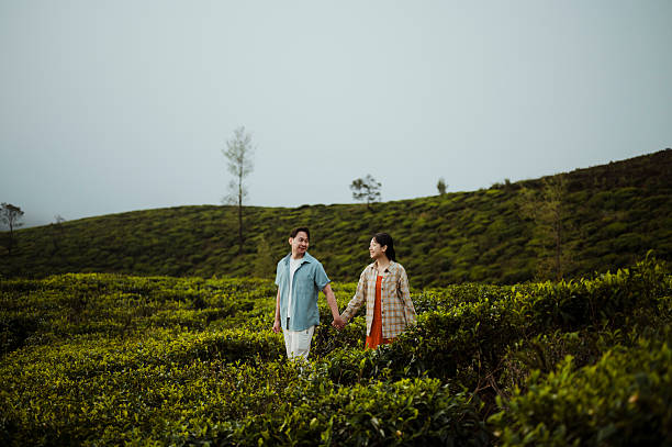 istock Couple Walking Through Scenic Tea Plantation 2236931933