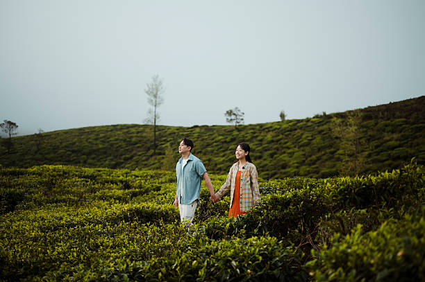 istock Couple Walking Through Scenic Tea Plantation 2236931935