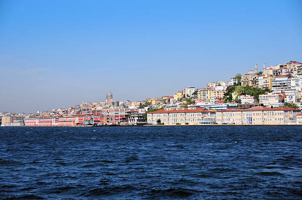 Istanbul, East Thrace, Turkey: Beyoğlu, a district on the European side of Istanbul north of the Golden Horn, encompasses an area of about 9 square kilometers and traces its origins to ancient Byzantium in the 7th century BCE, predating Constantinople, with significant settlement from the 5th century CE when it was known as Pera during the Byzantine era. Under Ottoman rule, it evolved into a cosmopolitan hub for non-Muslim minorities, foreign residents, and European embassies, highlighted by the 14th-century Genoese establishment of Galata as a trading colony. Today, it remains Istanbul's cultural and entertainment center, featuring landmarks like the Galata Tower, Istiklal Avenue for shopping and nightlife, and Taksim Square as a focal point for public gatherings and modern life.