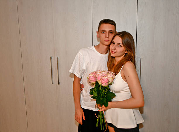 Family, parents, sisters and boyfriend congratulate the young girl on her birthday.