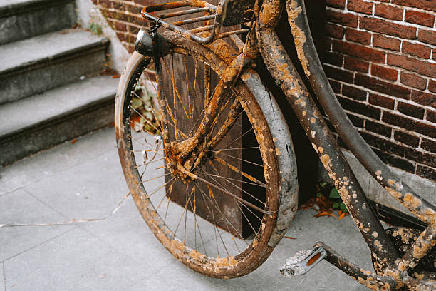 This bicycle has been just taken out of the river bed. Laval City, France.