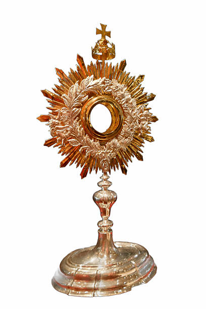 istock Beautiful silver and gold monstrance displayed in a church, illuminated by bright light during a religious ceremony 2236938762