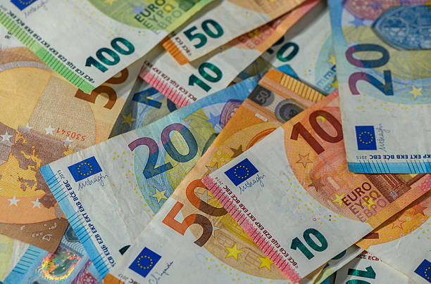istock Euro banknotes of various denominations on table closeup 2236939197